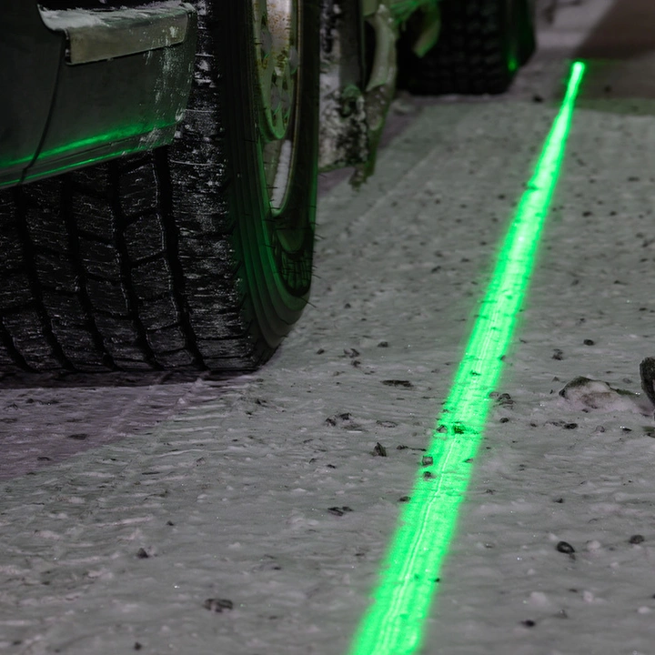 kuvituskuva, laserviiva renkaan vieressä